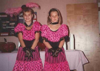 Two girls in identical dress costumes