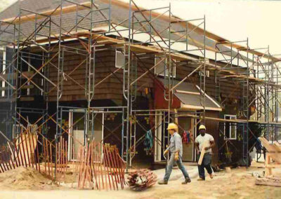 Building with workers and scaffolding
